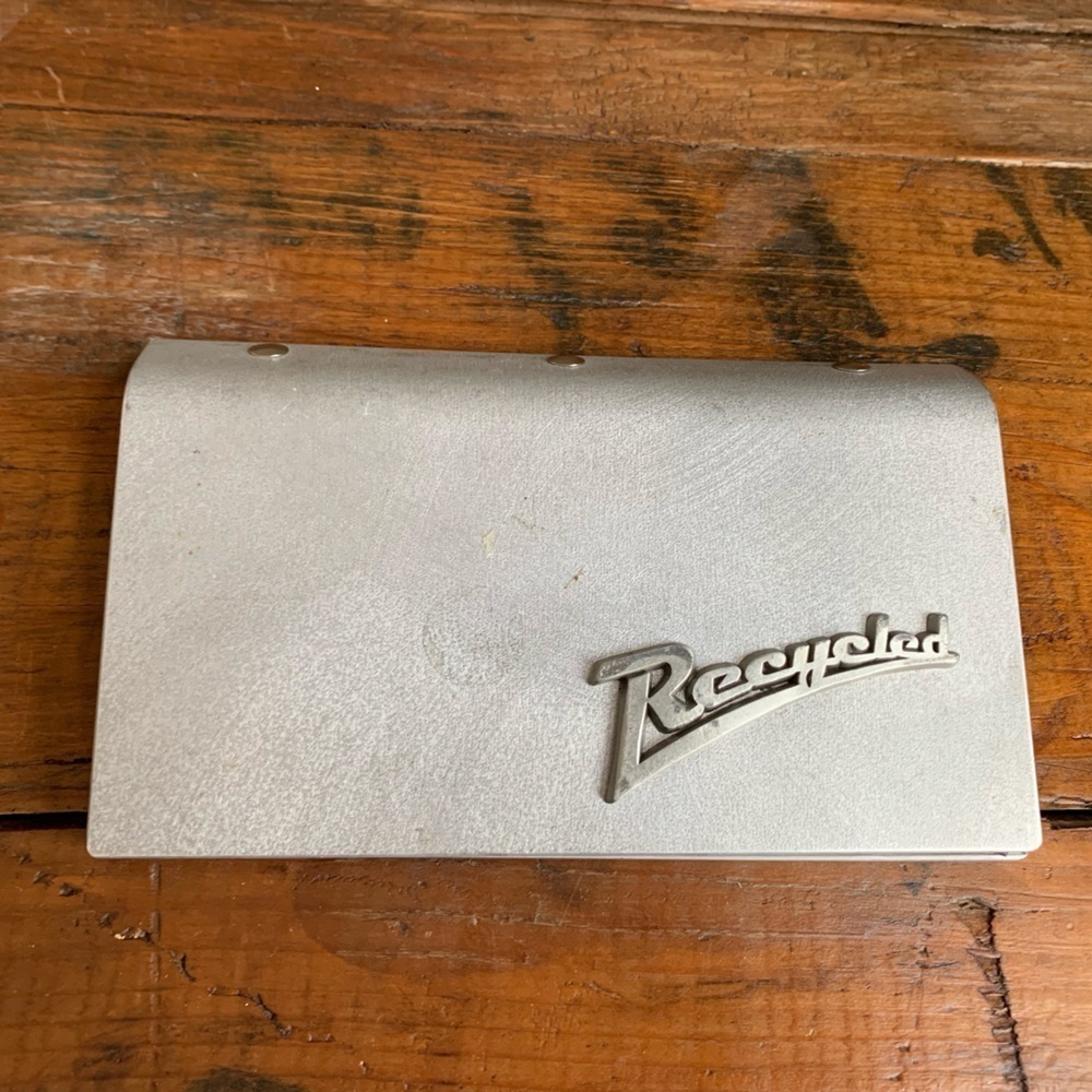 Little earth recycled checkbook cover, made out of a street sign